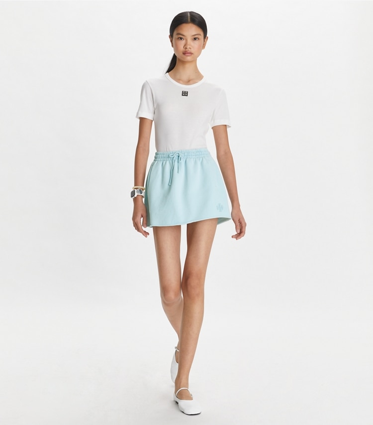 Tory Sport designer bottoms French Terry Mini Skirt in Pastel Sky on model front