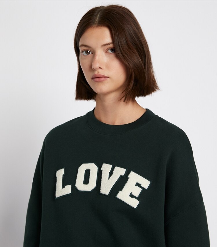 Tory Sport designer sweaters French Terry Varsity Crewneck in Conifer on model detail