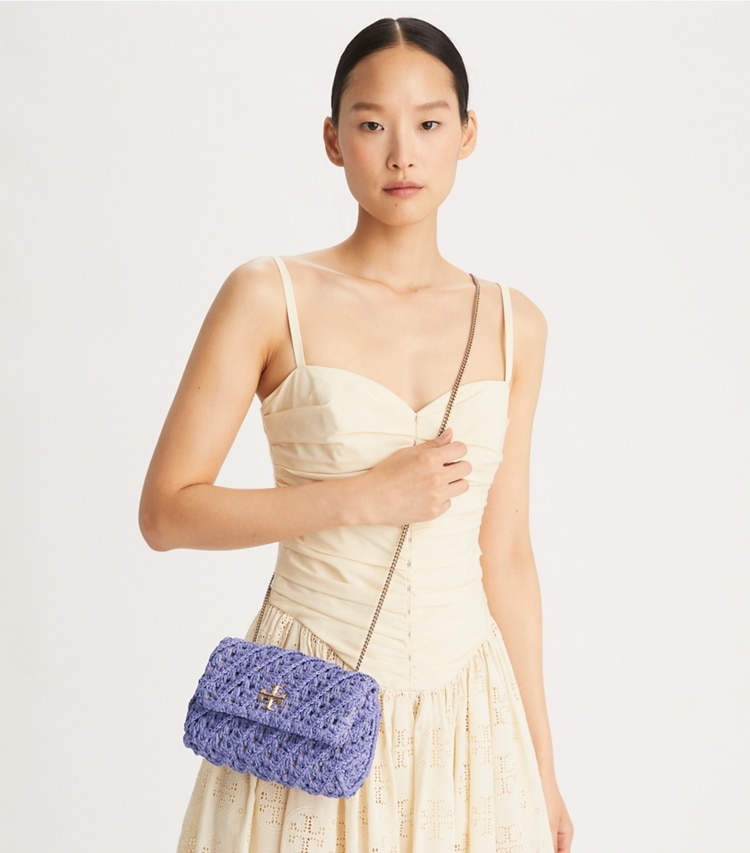 Tory Burch designer crossbody bags Gehäkelte Kira Mini Bag in Dark Lotus accessory on model