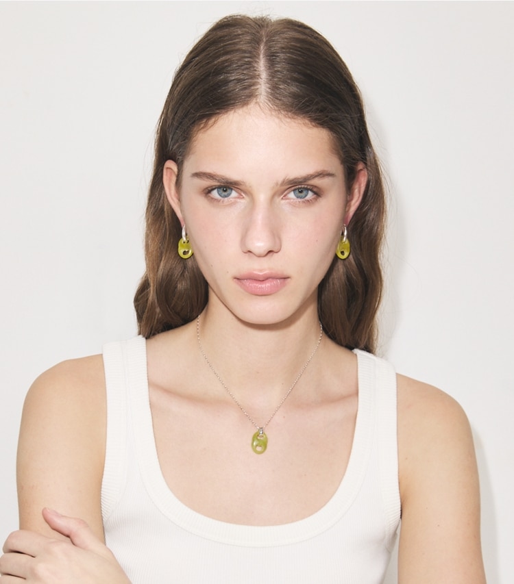 Tory Burch designer earrings Gemini Link Small Hoop Earrings in Ligh Brass / Light Blue accessory on model