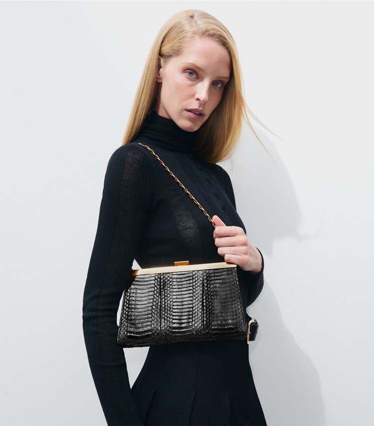 Tory Burch designer clutches Gemini Link Snake Frame Clutch in BLACK accessory on model