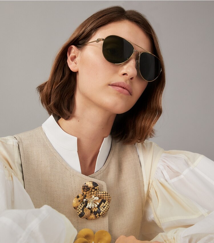 Tory Burch designer sunglasses & eyewear Gemini Pilot in SHINY GOLD/GREY GRADIENT accessory on model