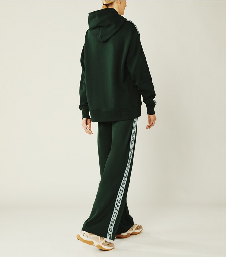 Tory Sport designer bottoms Geo-T Wide-Leg Track Pants in Conifer on model back
