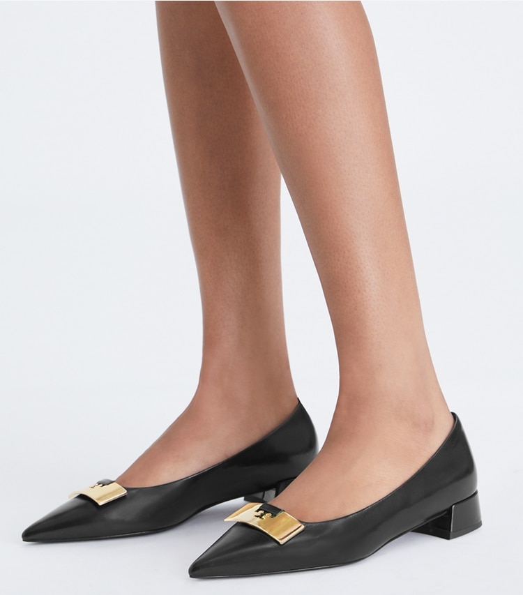 Tory Burch designer flats Gigi Petite Pump in PERFECT BLACK / GOLD additional on model