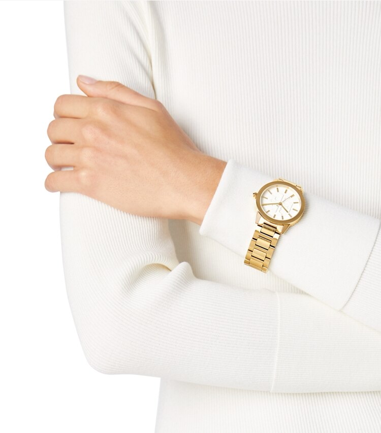 Tory Burch designer strap watches Gigi Watch, Gold Tone/Cream, 36 X 42 MM in Gold/Ivory accessory on model