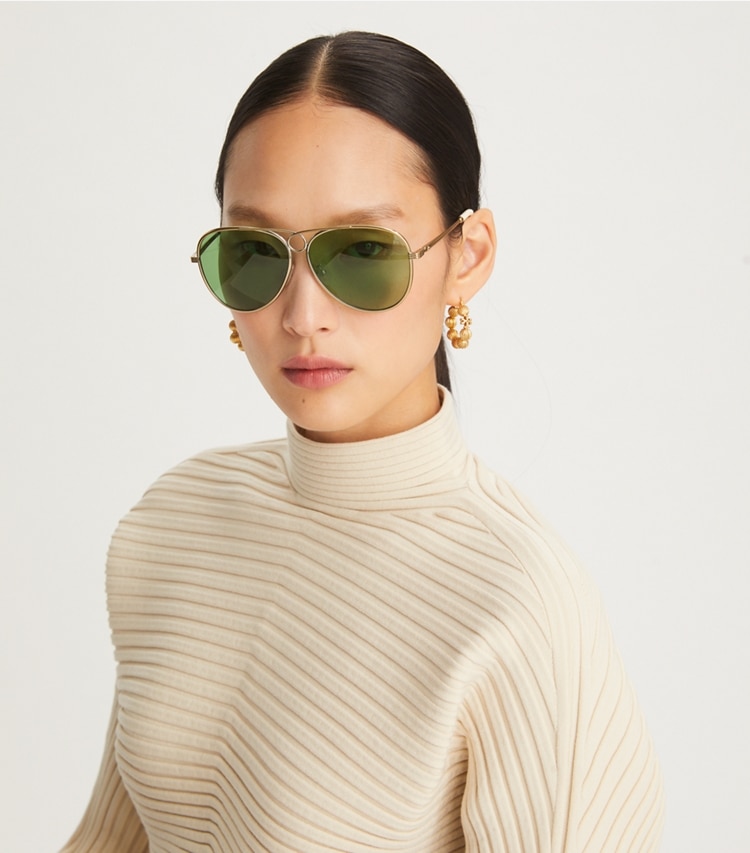 Tory Burch designer sunglasses & eyewear Gloria Pilot Sunglasses in TORY GOLD/SOLID DARK GREEN accessory on model
