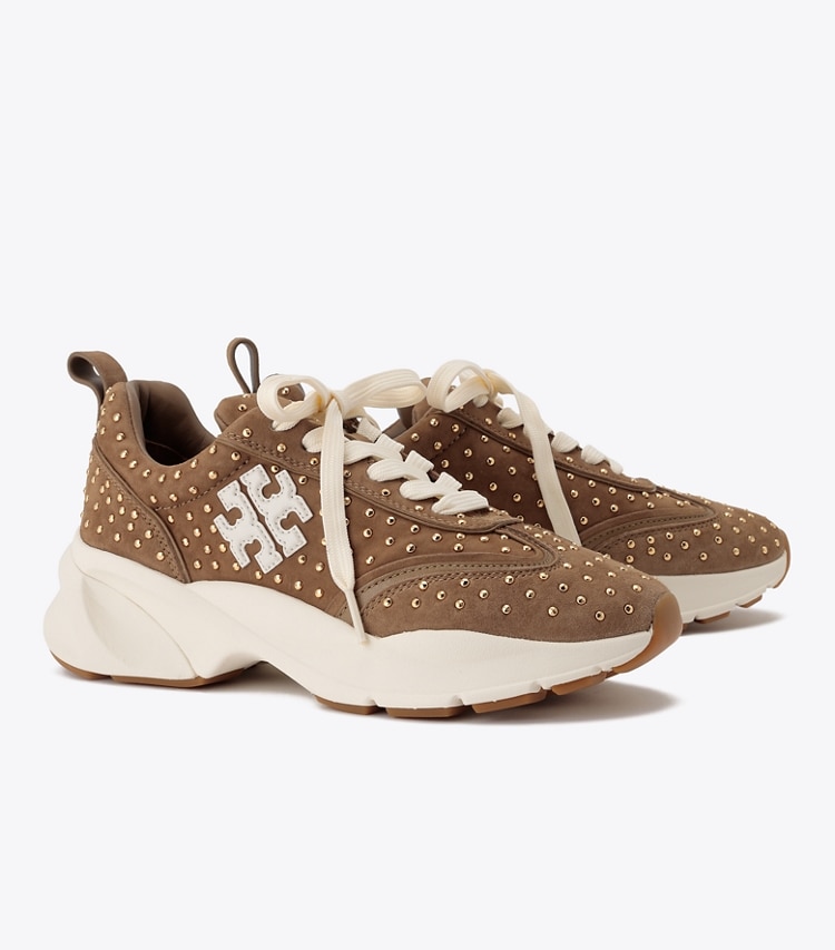 Tory Burch designer sneakers Good Luck Studded Trainer in ALCE / GOLD angle