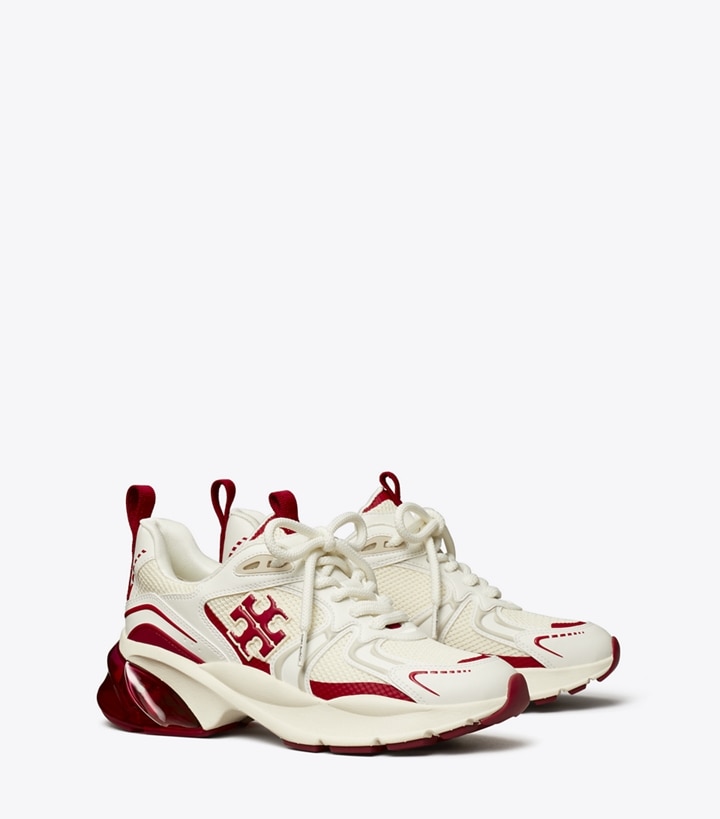 Tory Burch designer sneakers Good Luck Tech Trainer in NEW IVORY / TORY RED angle