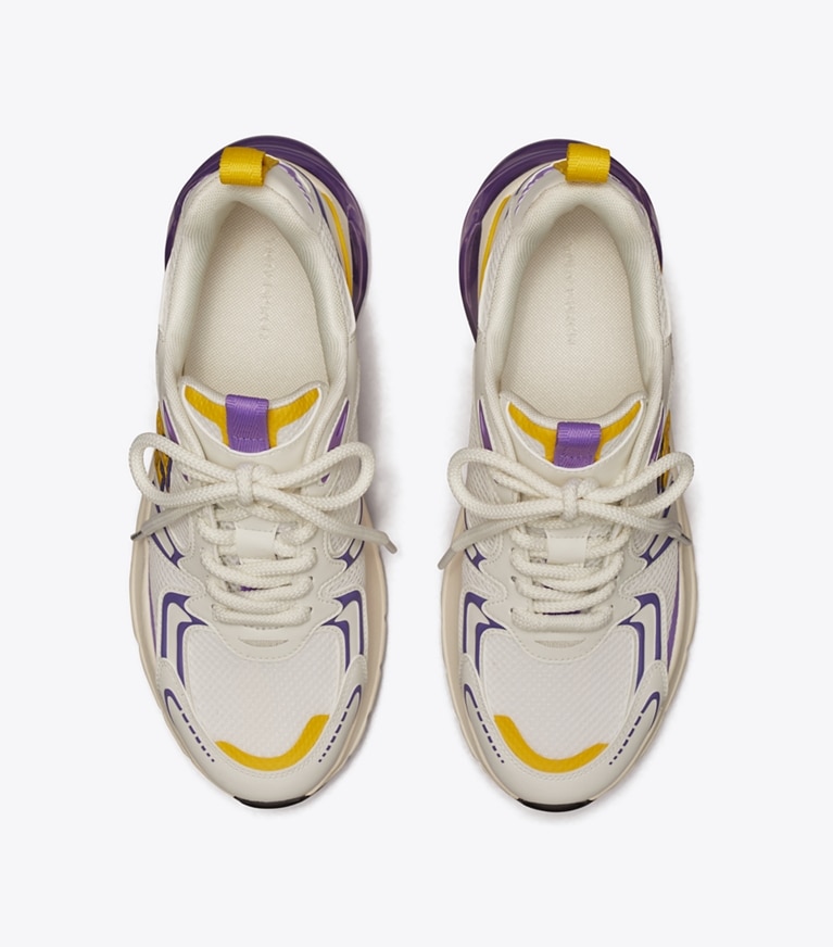 Tory Burch designer スニーカー グッドラック テック トレーナー in NEW IVORY/GOLDEN BRIGHT/DARK LOTUS angle