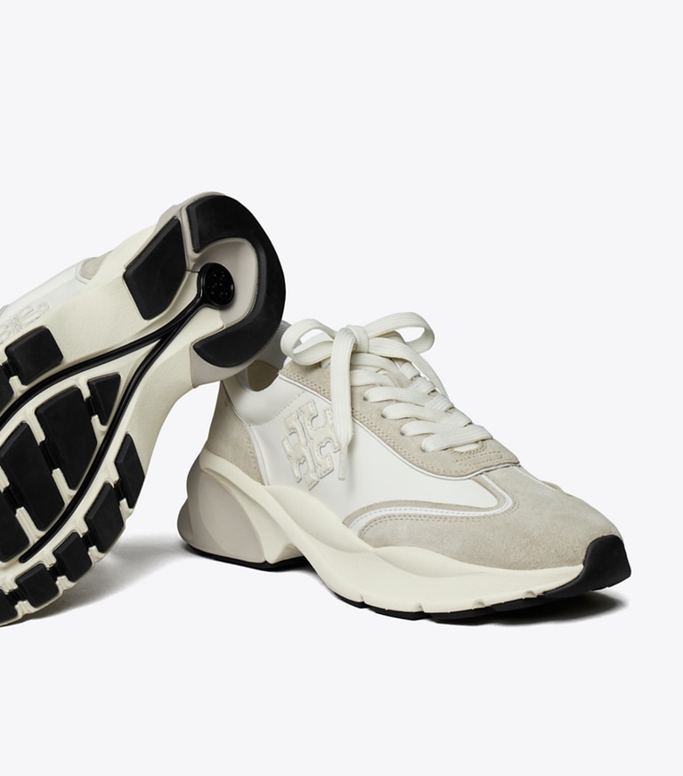 Tory Burch designer sneakers Good Luck Trainer in BIANCO / FOSSIL STONE angle