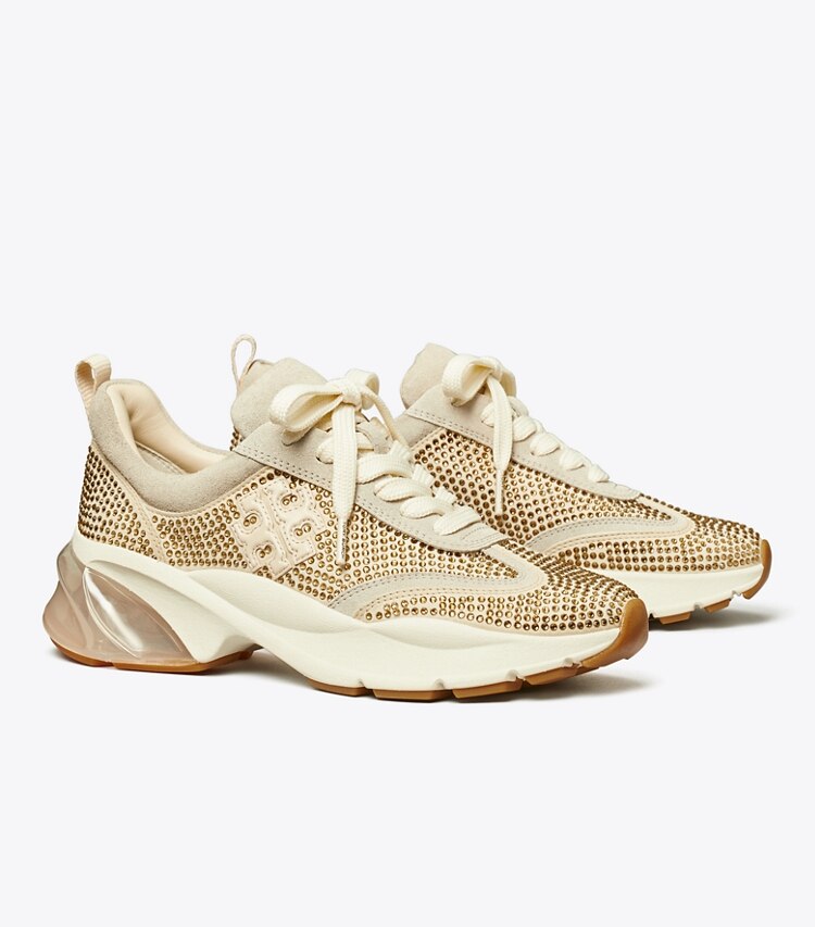 Tory Burch designer sneakers Good Luck Trainer in CHAMPAGNE / CALCARE / NEW CREAM angle