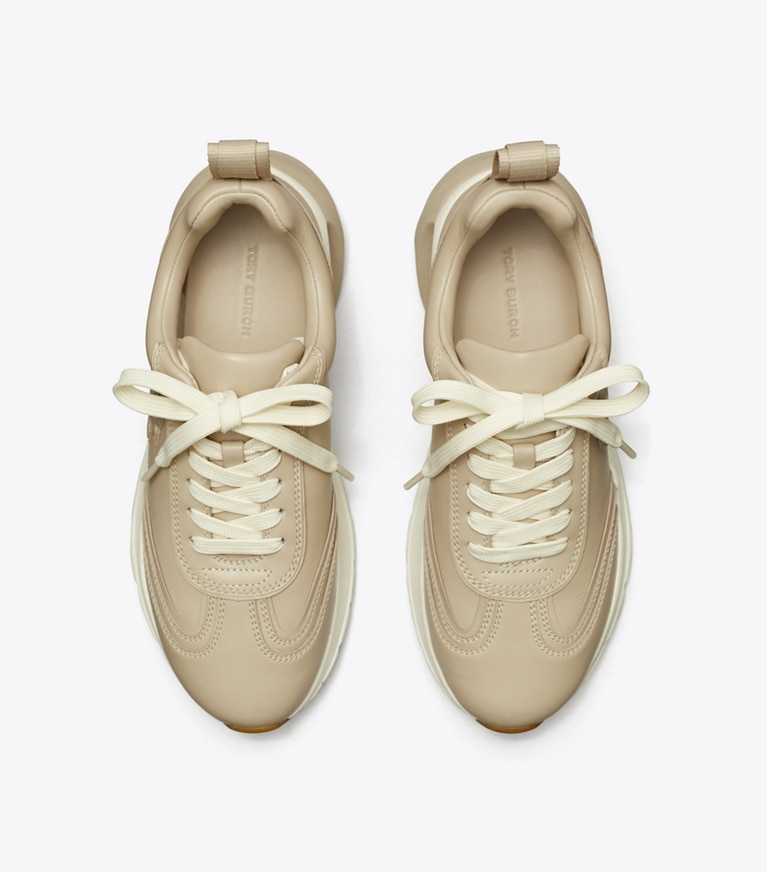 Tory Burch designer sneakers Good Luck Trainer in STONE GREY angle
