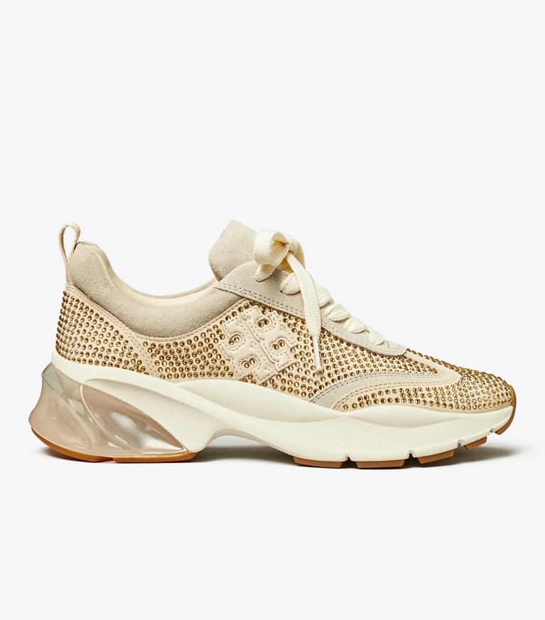 Tory Burch designer sneakers Good Luck Trainer in CHAMPAGNE / CALCARE / NEW CREAM angle