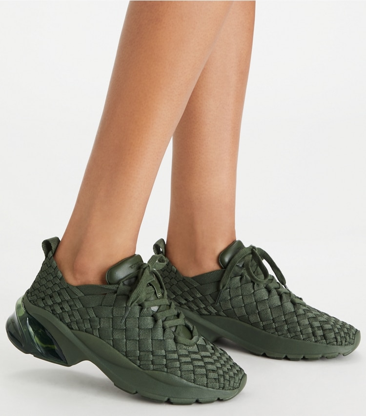 Tory Burch designer sneakers Good Luck Woven Trainer in DARK GREEN accessory on model