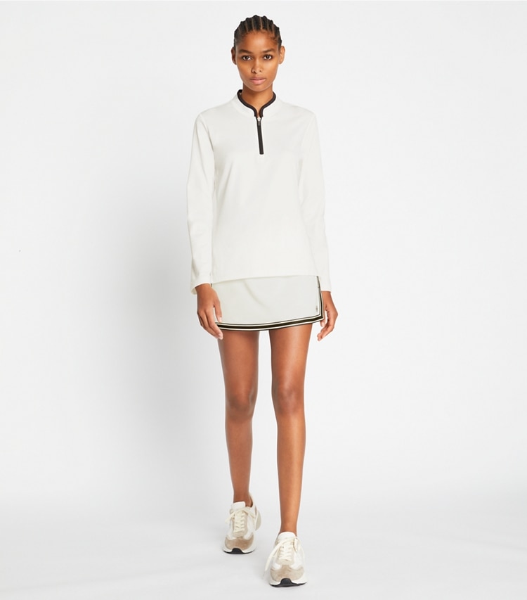 Tory Sport designer tops Half-Zip Performance Pullover in Snow White on model front