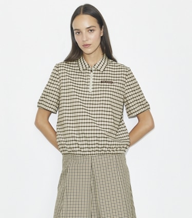 Tory Burch designer トップス プレイド ハーフジップ ポロシャツ in Ivory / Black Plaid on model detail