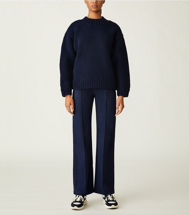 Tory Sport designer sweaters Hand-Knit Sweater in Tory Navy on model front