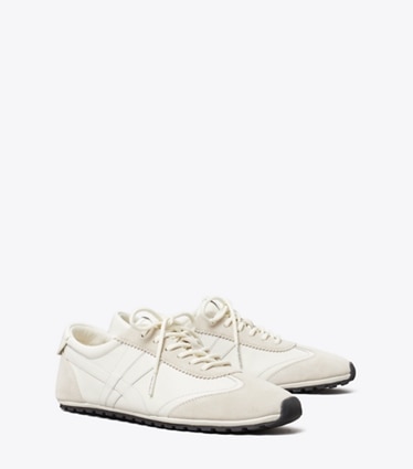 Tory Burch designer sneakers Hank Field Sneaker in CREAM / CREAM / CALCARE angle