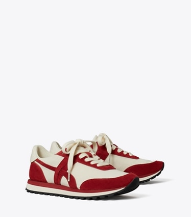 Tory Burch designer sneakers Hank Sneaker in NEW IVORY / GEMSTONE / TITANIUM WHITE angle