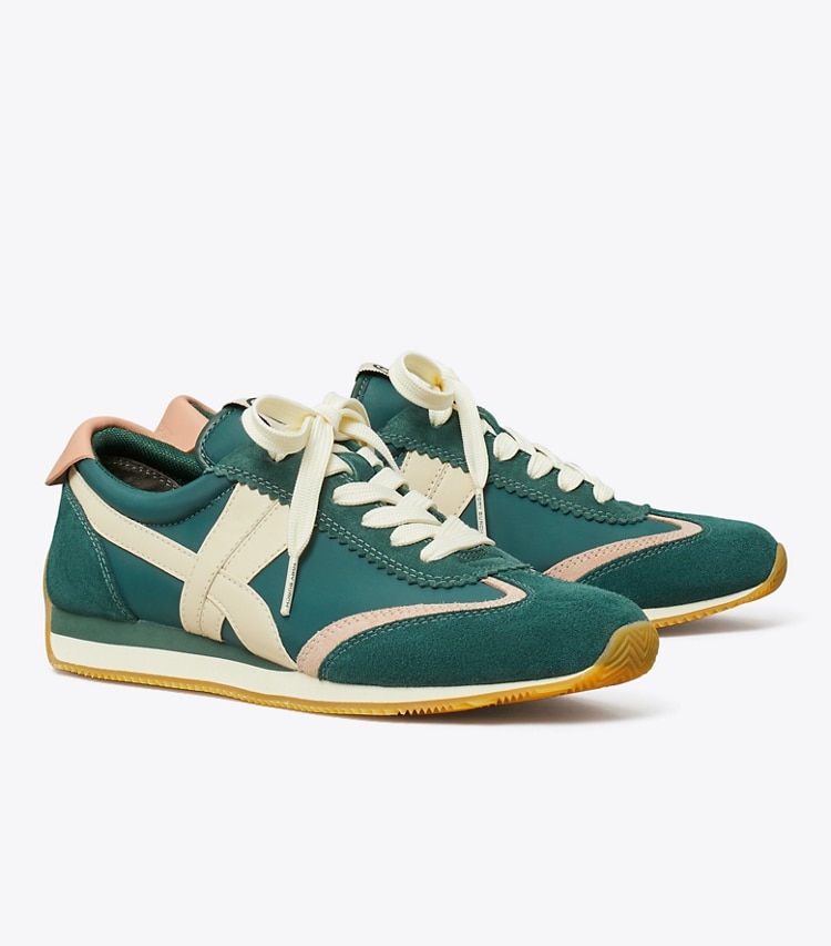 Tory Burch designer sneakers Hank Sneaker in Bottle Green / Pink Moon angle