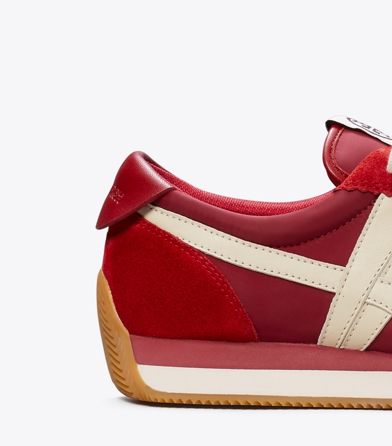 Tory Burch designer sneakers Hank Sneaker in BERRY/ BERRY angle
