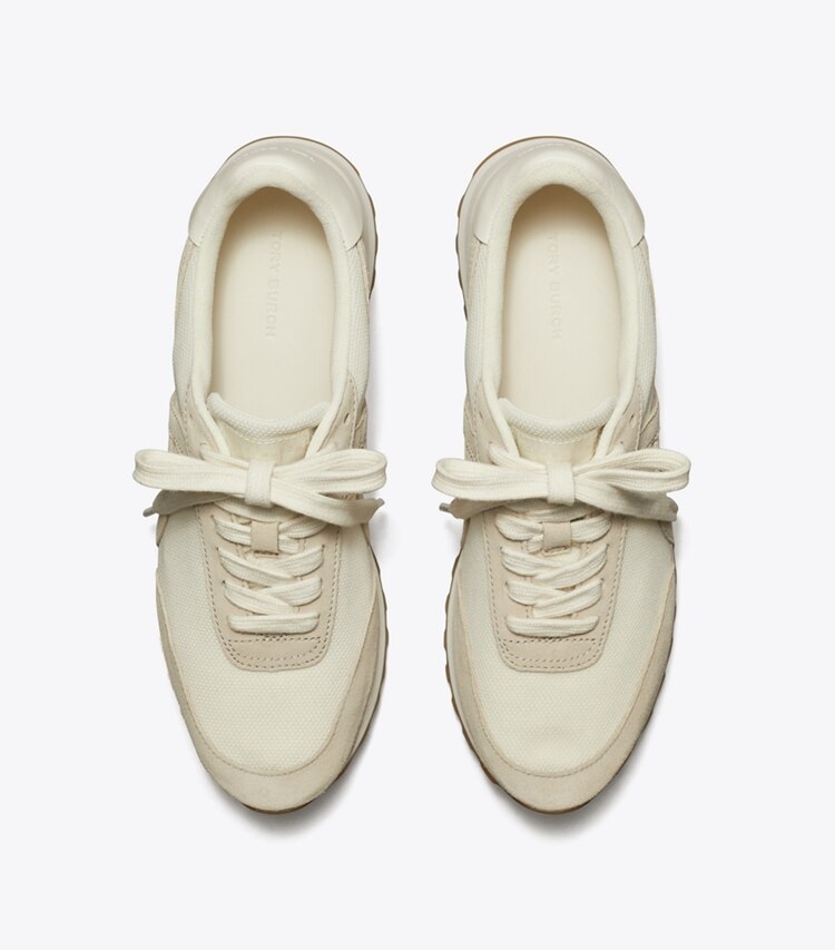 Tory Burch designer sneakers Hank Sneaker in NEW IVORY / CALCARE / TITANIUM WHITE overhead