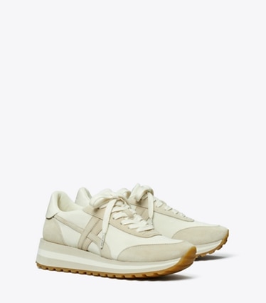 Tory Burch designer sneakers Hank Wedge Sneaker in NEW IVORY / CALCARE / TITANIUM WHITE angle