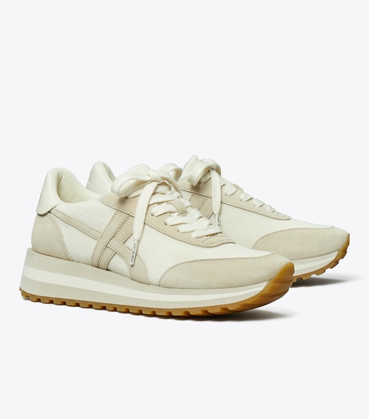 Tory Burch designer sneakers Hank Wedge Sneaker in NEW IVORY / CALCARE / TITANIUM WHITE angle