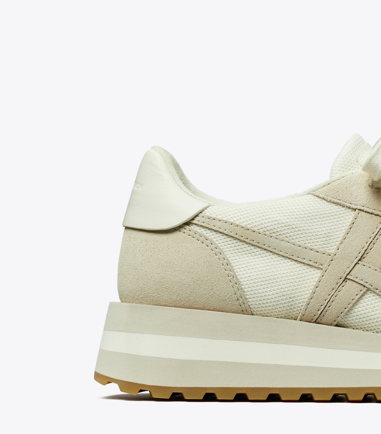 Tory Burch designer sneakers Hank Wedge Sneaker in NEW IVORY / CALCARE / TITANIUM WHITE angle