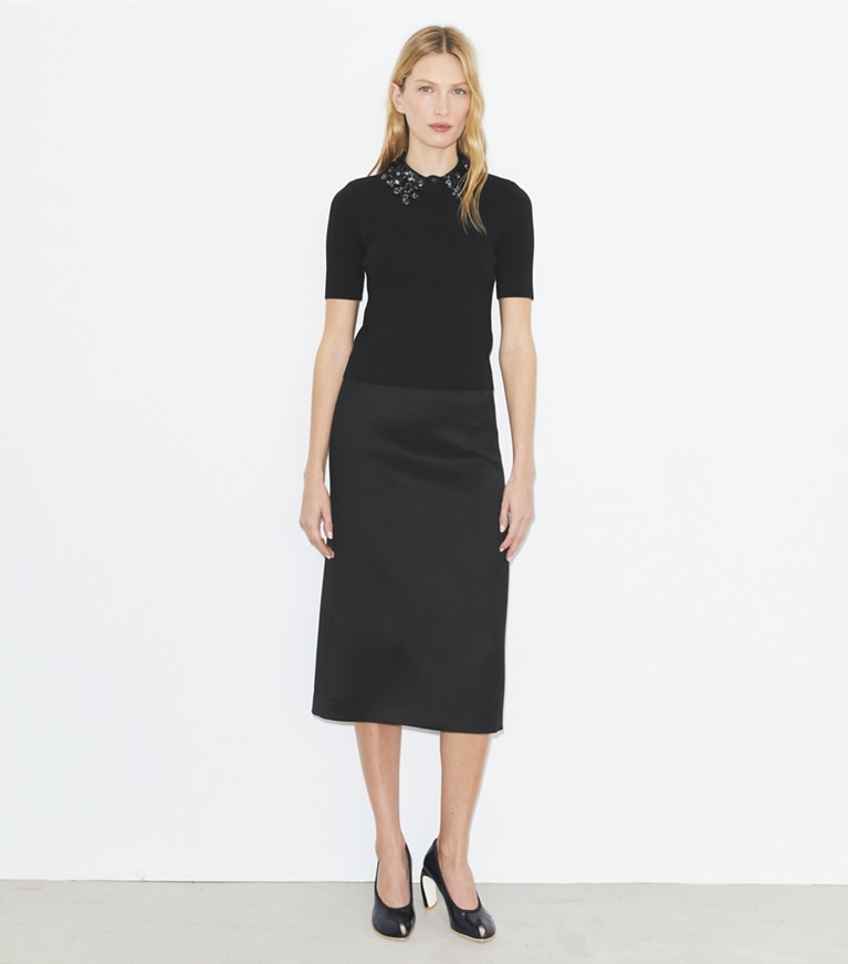 Tory Burch designer hauts Haut à manches courtes et col ornementé in Black front