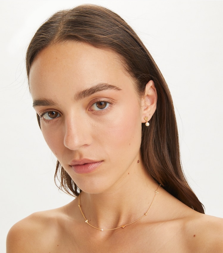 Tory Burch designer jewelry boxes Heart Earrings And Necklace Set in Tory Gold / Pearl / Crystal accessory on model