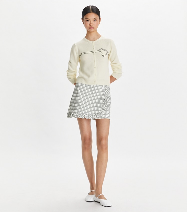 Tory Sport designer sweaters Heart Pick Stitch Cashmere Cardigan in NEW IVORY on model front
