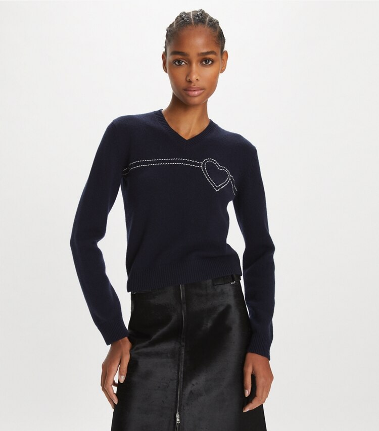 Tory Sport designer sweaters Heart Pick Stitch Cashmere Sweater in Tory Navy / New Ivory on model detail