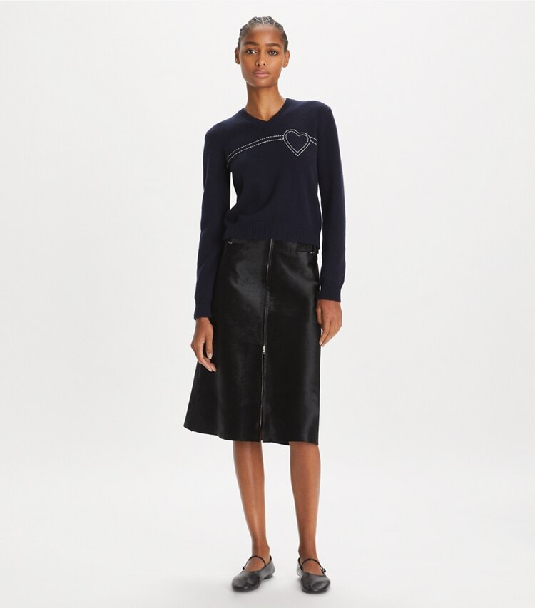 Tory Sport designer sweaters Heart Pick Stitch Cashmere Sweater in Tory Navy / New Ivory on model front