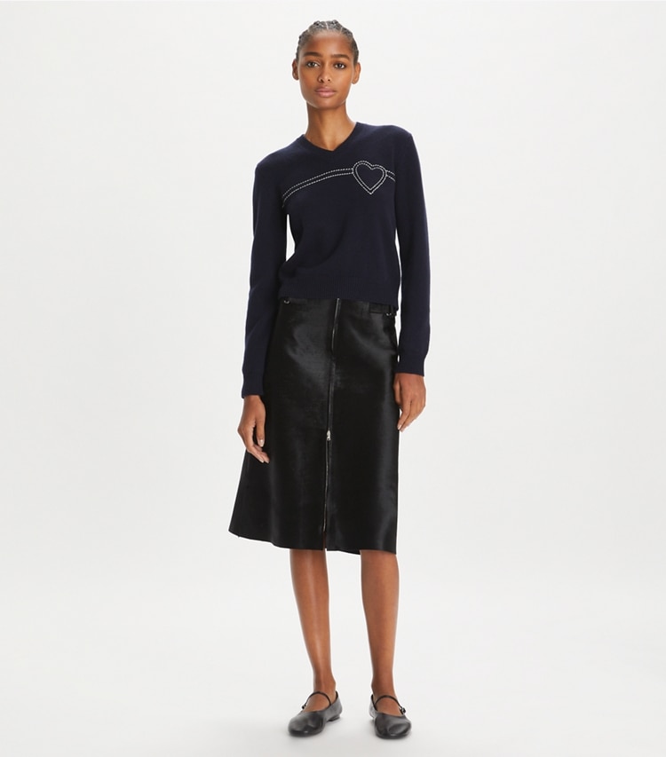 Tory Sport designer sweaters Heart Pickstitch Cashmere Sweater in Tory Navy / New Ivory on model front