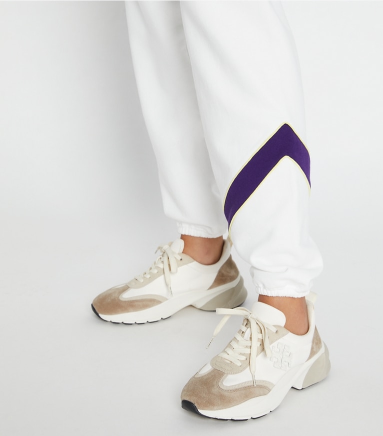 Tory Sport designer bottoms Heavy French Terry Chevron Sweatpant in Snow White / Eggplant front