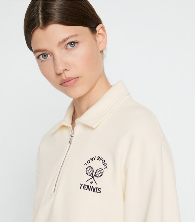 Tory Sport designer tops Heavy French Terry Half-Zip Tennis Pullover in Ivory Pearl / Tory Navy on model detail