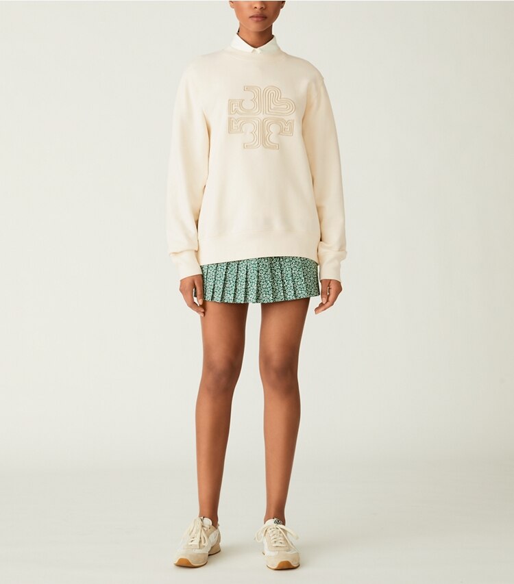 Tory Sport designer sweaters Heavy French Terry Heart Logo Crewneck in Ivory Pearl on model front