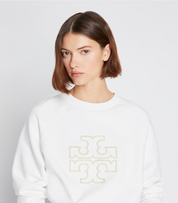 Tory Burch designer sweaters Heavy French Terry Logo Crewneck in Snow White on model detail