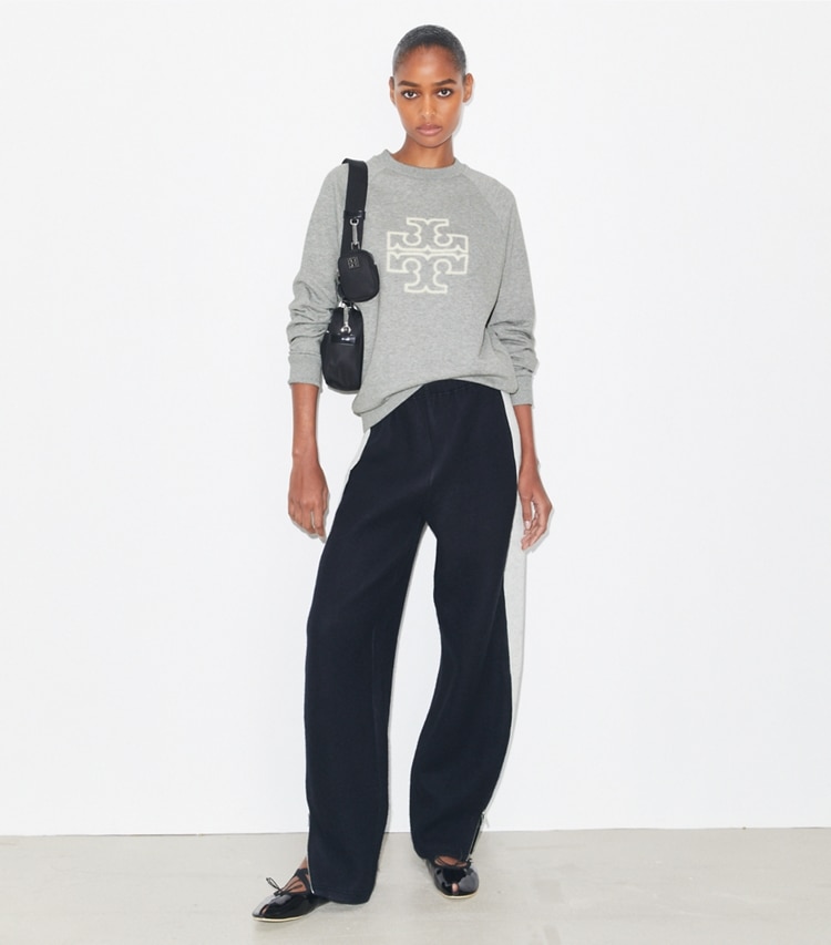 Tory Burch designer sweaters Heavy French Terry Logo Crewneck in Medium Grey Heather on model front