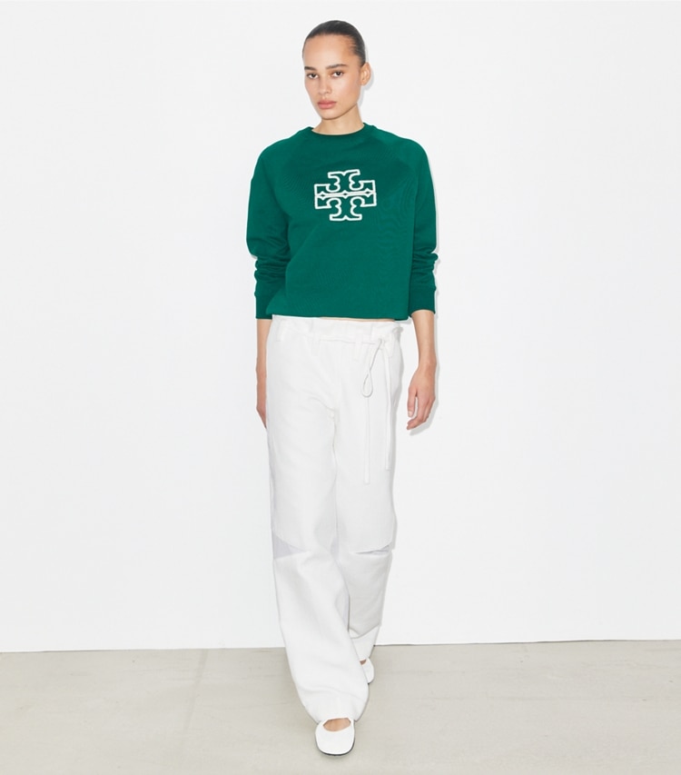 Tory Burch designer sweaters Heavy French Terry Logo Crewneck in Emerald on model front