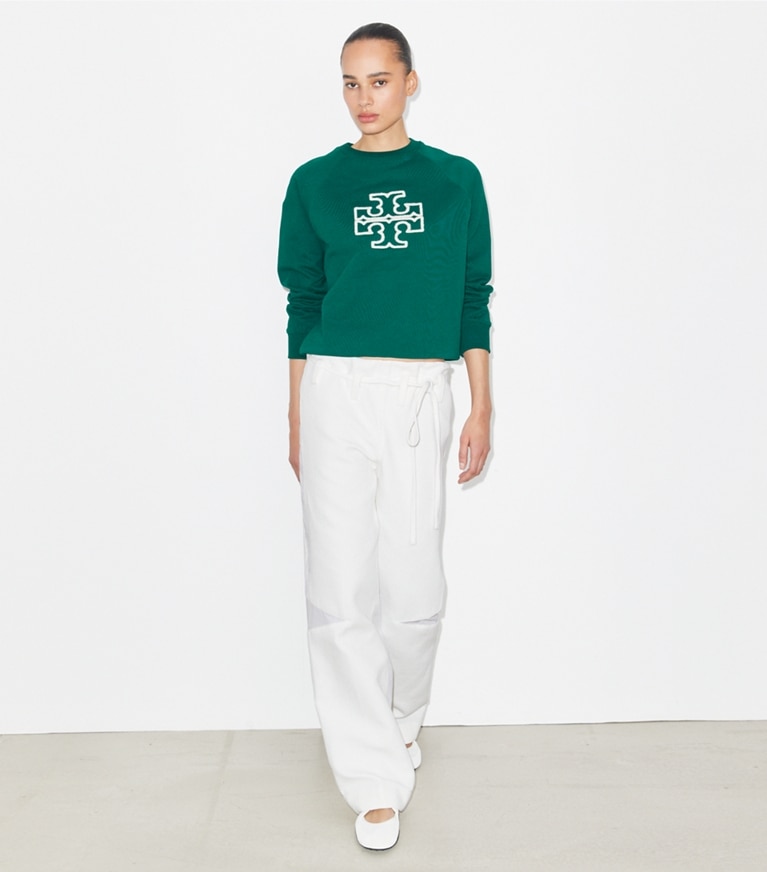 Tory Burch designer sweaters Heavy French Terry Logo Crewneck in Emerald on model front