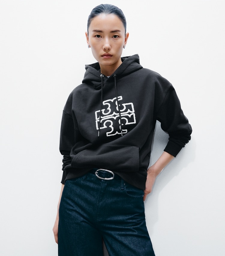 Tory Burch designer sweaters Heavy French Terry Logo Hoodie in Black on model detail