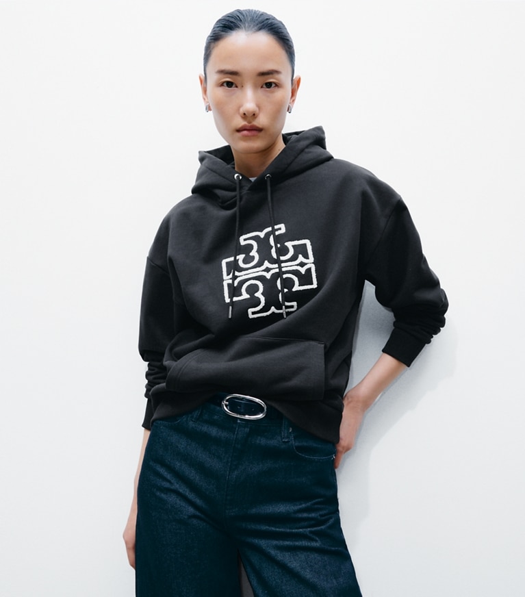 Tory Burch designer sweaters Heavy French Terry Logo Hoodie in Black on model detail