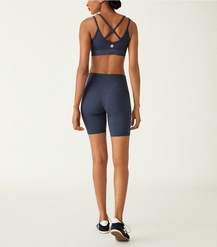 Tory Sport designer bottoms High-Rise Compression Mélange Bike Short in Tory Navy Heather on model back