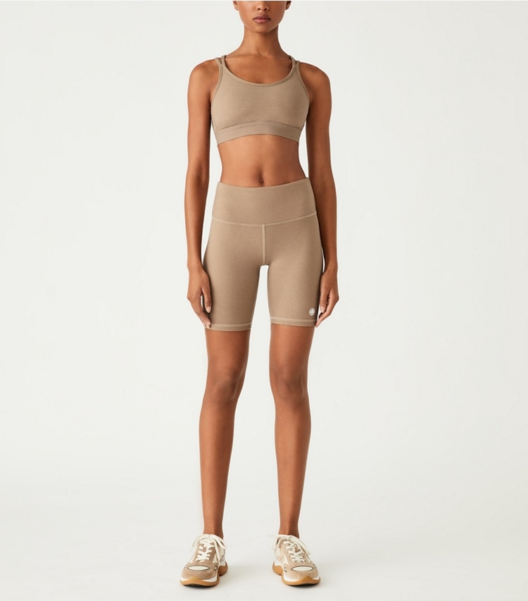 Tory Sport designer bottoms High-Rise Compression Mélange Bike Short in Natural Heather on model front