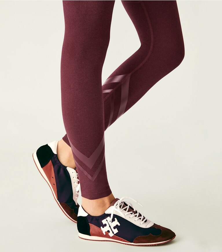 Tory Sport designer bottoms High-Rise Compression Mélange Side-Pocket Chevron Legging in Winetasting Heather front