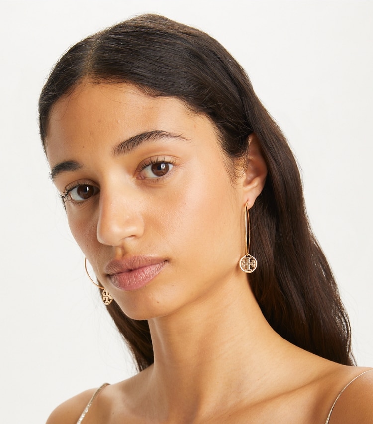 Tory Burch designer earrings Hoop Earring in Tory Gold accessory on model