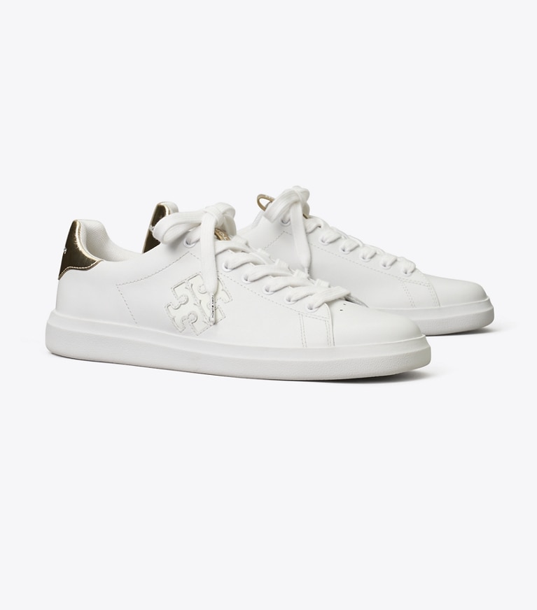 Tory Burch designer sneakers Howell Court Sneaker in Titanium White / Spark Gold angle