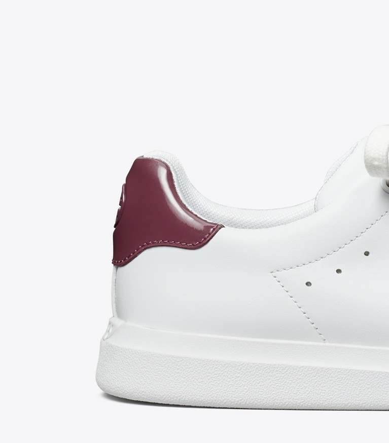Tory Burch designer sneakers Howell Court Sneaker in Titanium White / Vintage Eggplant angle